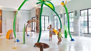 An indoor water play area with a tropical theme, including a large archway labeled 'Kingston Plantation' and various water features. - 705 Margate, 3 bedroom ocean front condo 3 Condo (Myrtle Beach)