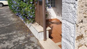 A building with a stone facade, a wooden door, and a mailbox. - Rome in Love Caffarella - Metro P. Lungo (Rome)