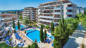 Seasonal outdoor pool, pool umbrellas, pool loungers