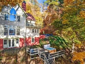 Outdoor spa tub - Spacious Lakeside Retreat with Dock and Hot Tub! (Lansing)