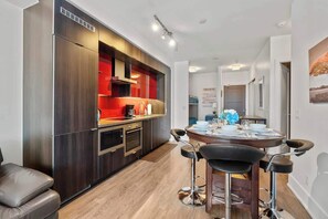 Great kitchen and dining area for you and your guests to enjoy. - Downtown 1B + D Condo, Central Location, Parking (Toronto)