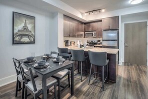 Comfortable dining area ideal for meals, work, or relaxed gatherings. - Cozy 1BR Downtown Stay with Balcony Views (Toronto)