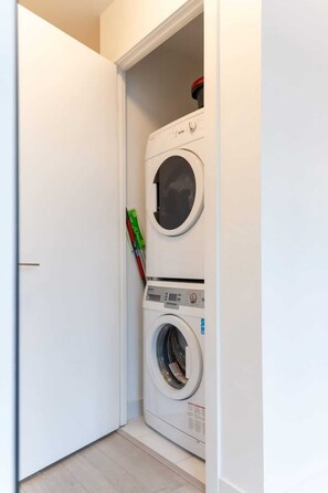 Washer and dryer machines for guests' use - Top Graded Metropolitan Suite w/ Free Parking (Toronto)