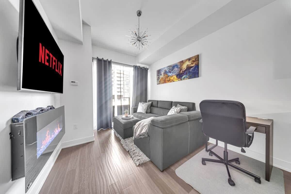 Stylish condo with a fireplace, Netflix, and a workspace—perfect for a cozy stay!