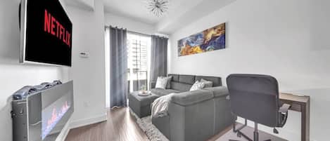Stylish condo with a fireplace, Netflix, and a workspace—perfect for a cozy stay!