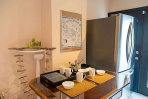 Fully equipped kitchen with modern appliances for all your cooking needs. - Stylish 2BR Home with Front Yard & Free Parking (Toronto)