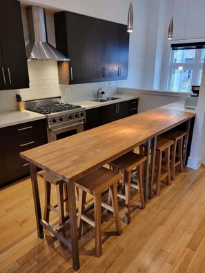 Share meals and memories in a cozy dining space perfect for any gathering. - Remodeled 3BR Urban Retreat w/ Offices & Parking (Toronto)
