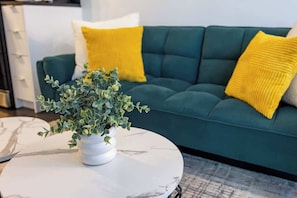 Relax in the cozy living space featuring a cozy sofa, smart TV, and fun games for your downtime. - Downtown Urban Oasis I Entertainment District (Toronto)
