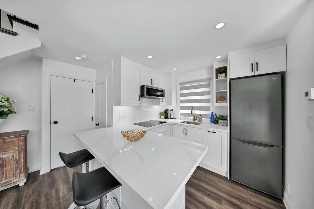 Fully stocked kitchen with modern appliances for all your cooking needs.