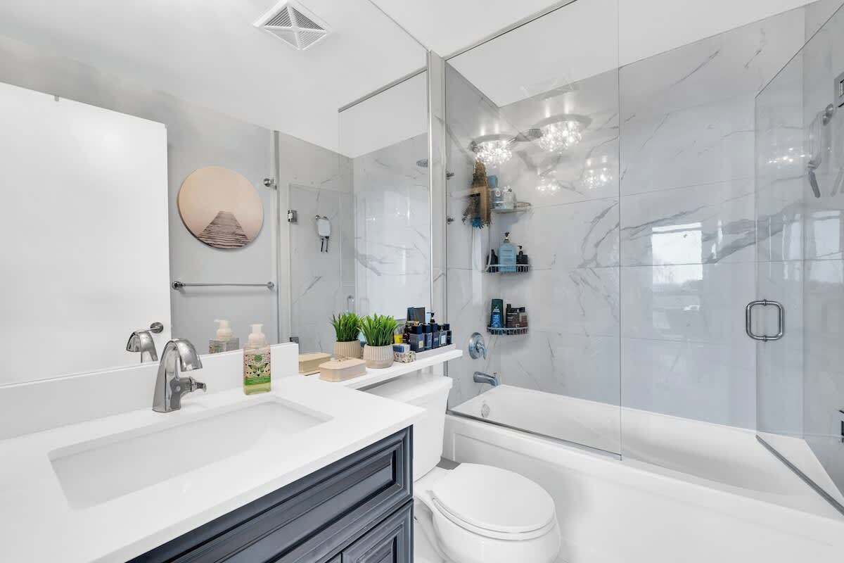 Two clean, fully stocked bathrooms with bathtubs