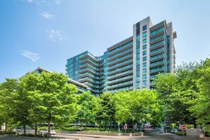 Welcoming exterior with easy access and a clean, well-maintained facade—your home away from home starts here. - Chic 1BR+Den Condo | Fast WiFi & Free Parking (Toronto)