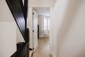 "Charming hallway with a clean layout and warm atmosphere, creating a pleasant entry to each room. - Toronto Home • 4BR + Private Patio + 2 Parking (Toronto)