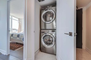 Convenient in-unit laundry with washer and dryer for your use. - Lakeview Condo | 2BR with Balcony & Free Parking (Toronto)