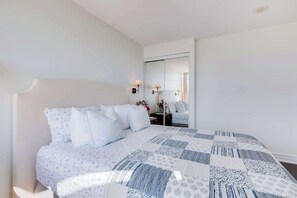 Bright and inviting bedroom with large windows and modern decor. - Lakeview Condo | 2BR with Balcony & Free Parking (Toronto)