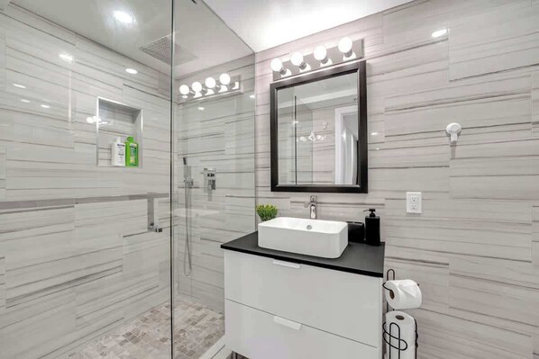 Fresh and spotless bathroom with all the essentials provided.