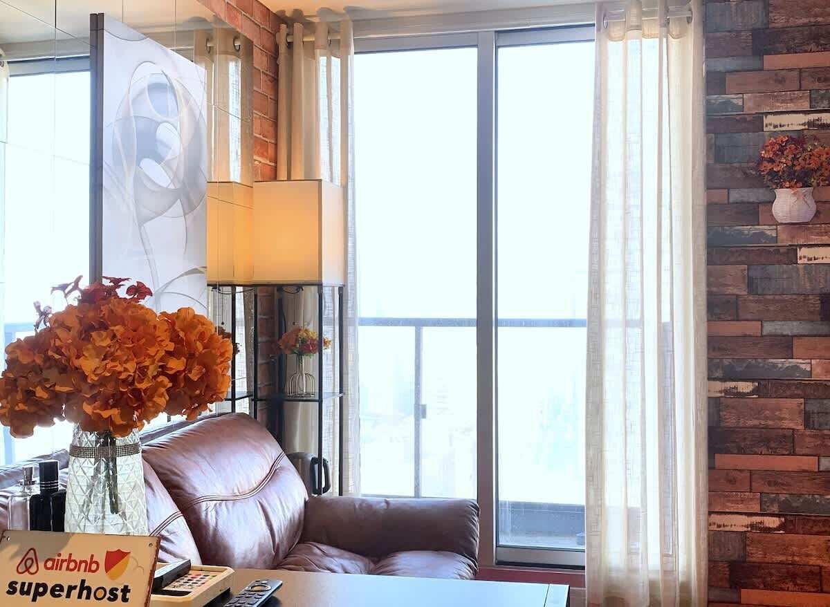 Bright living space with Smart TV and city views
