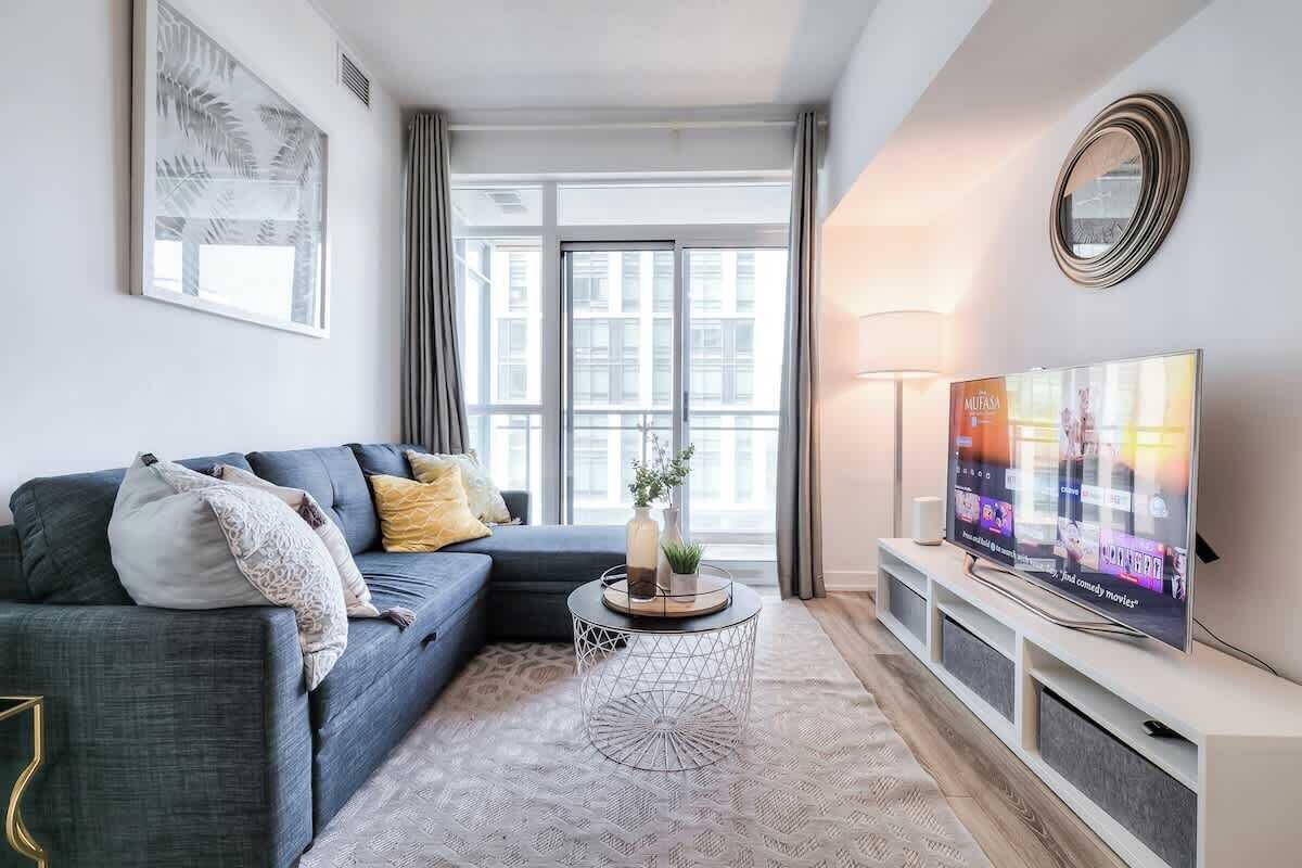 Kick back in our inviting living room with chic decor and ultra-comfy seating, your perfect spot to relax and catch your favorite show.