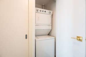 Stay fresh on the go with in-suite laundry, complete with a dedicated area for all your clothing needs. - Chic 2BR+D Condo w/Lake & CN Tower Views + Parking (Toronto)