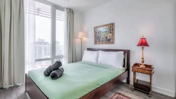 Sleep soundly in a plush Queen bed with crisp hotel-style linens and fluffy duvets.