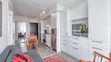 Relax and unwind in the cozy living space, complete with a smart TV and comfy seating.