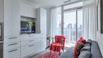 Relax and unwind in the cozy living space, complete with a smart TV and comfy seating.