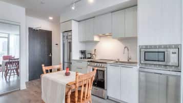 Compact dining nook perfect for meals, work, or planning your city adventures.