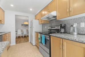 Cook up a storm in the fully stocked kitchen — complete with all major appliances and essentials. - Downtown 3BR Condo w/Parking, Walk to Hotspots (Toronto)
