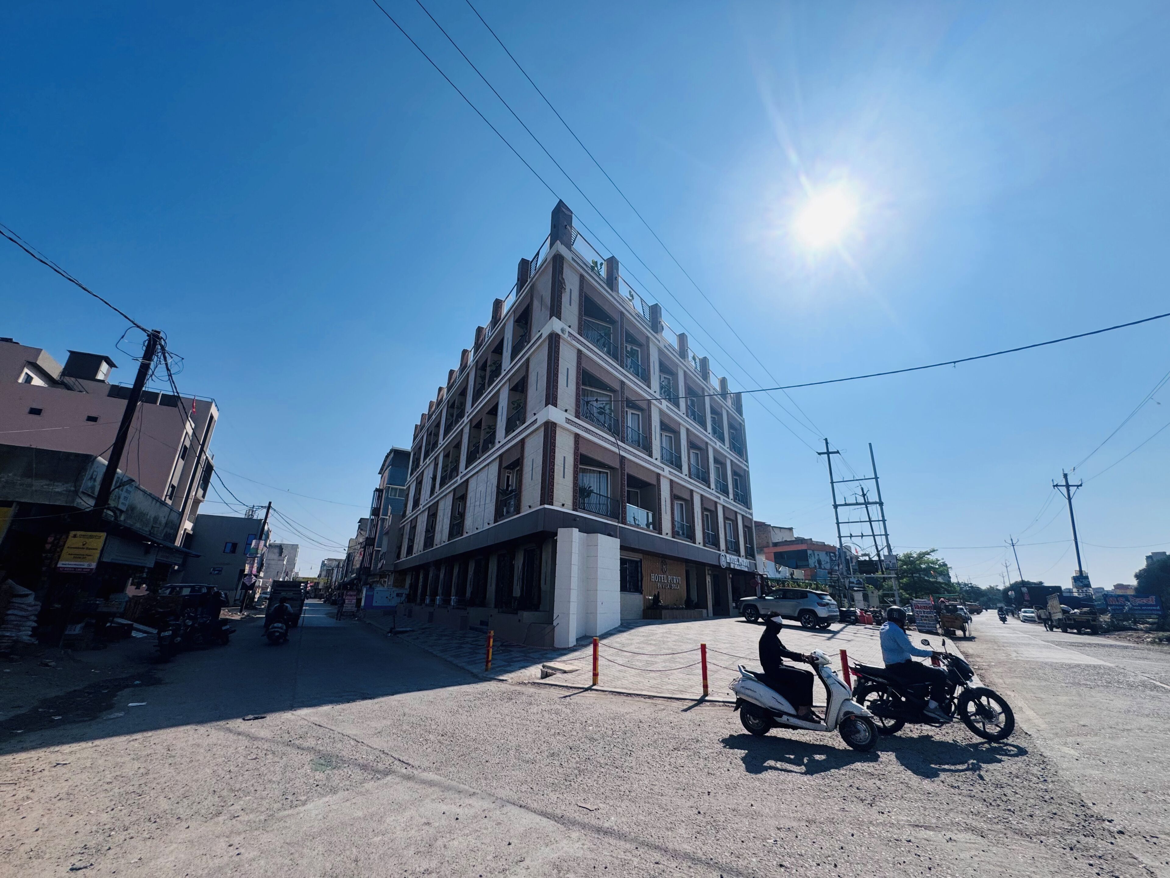 A multi-story building with a commercial ground floor, including a hotel and a restaurant.