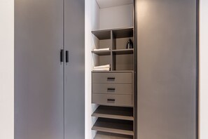 A modern wardrobe with multiple shelves and drawers. - Soho Village en Palermo by Magno | 304 (Buenos Aires)