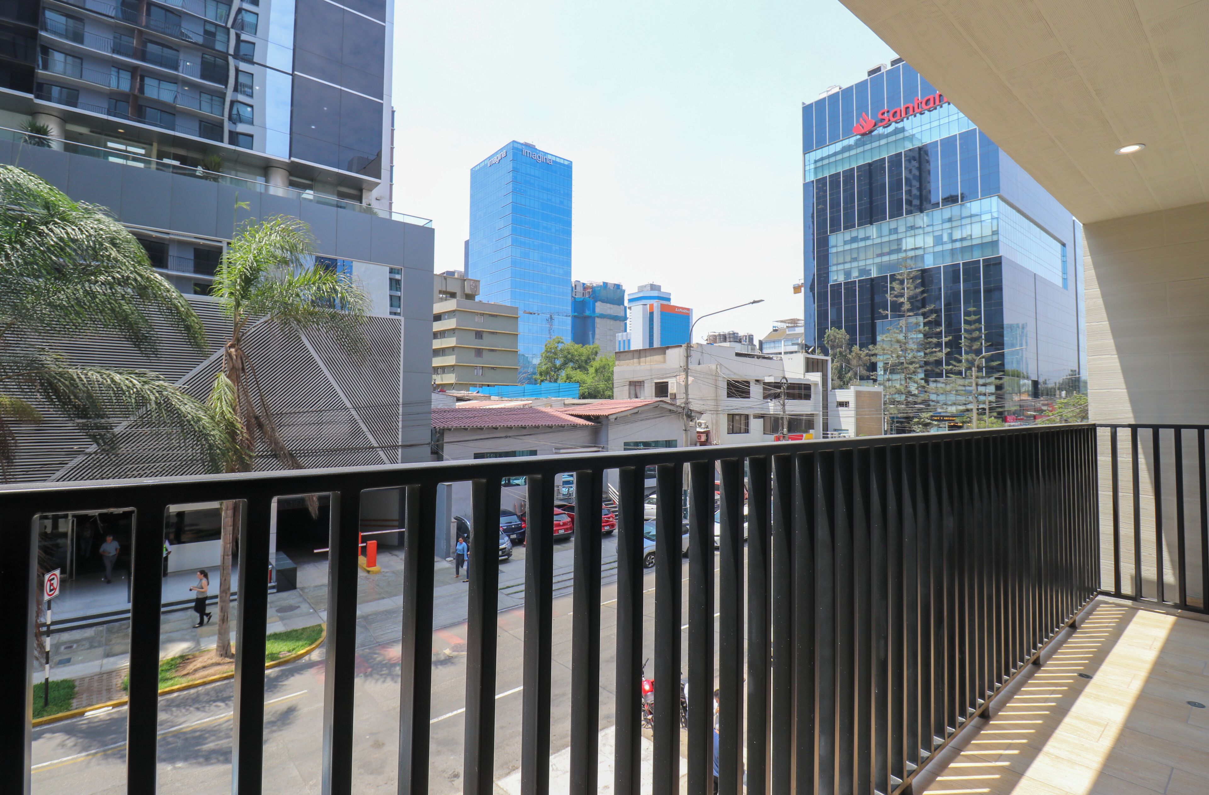 A cityscape with modern buildings, including a prominent Santal building.