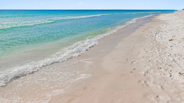 A beach with clear water and a sandy shore. - Crystal Village II 26A (Miramar Beach)
