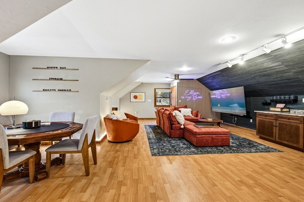 Enjoy foosball, skeeball, arcade games, poker, and more—perfect for friendly competition or laughs. Set the mood with neon lighting, or relax on the sectional for a cozy movie night in front of the 75-inch TV.