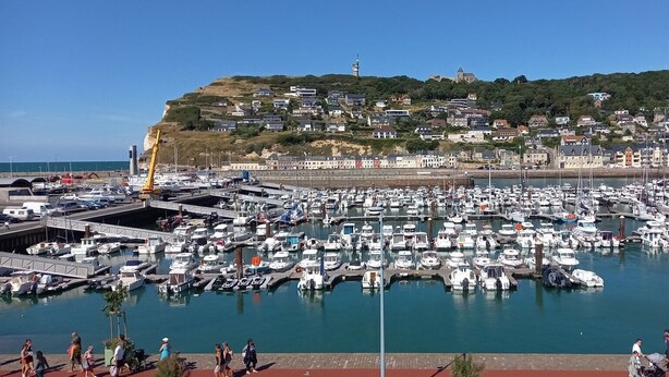 A marina with numerous boats docked, a bridge, and a hillside with buildings. - 3* Gîte: Port & Beach, 50m from the Sea, South-Facing, Quiet Location (Fécamp)