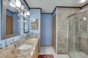 A bathroom with two sinks, a glass shower enclosure, and a mirror with lights. - 6 Mi to Rickenbacker Airport! Columbus Area Home (Groveport)