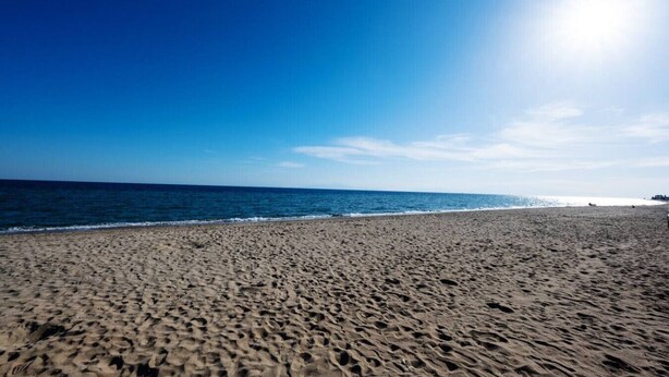 A beach with a clear sky and calm sea. - GnG Apartment 1 by RentalsPro - Nea Flogita (Nea Flogita)