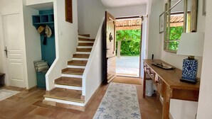 A staircase leading to a covered outdoor area, a wooden desk with a lamp, and a patterned rug. - 4-bed 3.5-bath Villa, Pool, Close to Callian- Pays de Fayence (Callian)