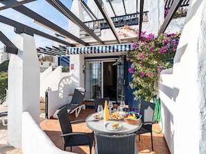 Apartamento | Restaurante al aire libre
