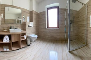 A modern bathroom with a vanity, toilet, and shower. - BELLESTAY/King Room with Balcony (Brașov)