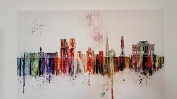 A colorful abstract painting of a city skyline.