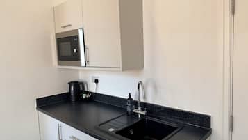 Fridge, microwave, cookware/dishes/utensils
