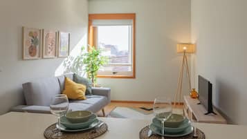 Apartamento superior, vistas a la ciudad | Zona de estar