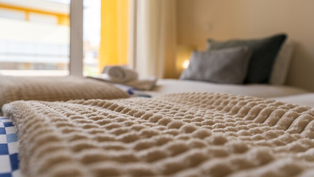 A hotel room with a bed, pillows, and a window with a view. - #356 Vale de Parra | Pool & Nature (Albufeira)