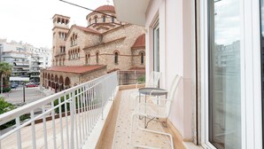 A balcony with a white railing, a table, and two white chairs. - Family, Sunny safe & cozy choice 1 Km Athens 3 bedrms, 120 sq.m  1300 sq.ft 1st (Kesariani)