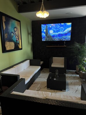 Habitación cuádruple estándar | Zona de estar