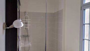 Shower, hair dryer, towels, toilet paper