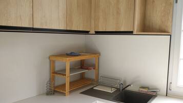 Fridge, microwave, stovetop, coffee/tea maker