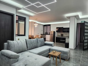 Deluxe Apartment, City View | Living area | Flat-screen TV - Hotel Boutique Batara (Filandia)