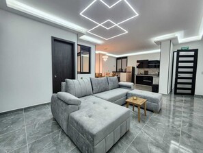 Apartamento Deluxe, vistas a la ciudad | Zona de estar