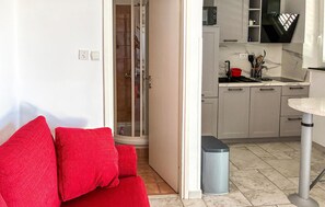 A modern kitchen with white cabinets, a marble countertop, and a small sink. - Gorgeous apartment in Barbat with house sea view (Barbat)