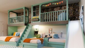 A children's playroom with bunk beds, a slide, and a staircase. - Rolling Ridge | Sleeps 23, GameRoom, Pets, Sauna, HeatedPool, Theater, & More (Laurelville)